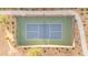 An aerial shot shows a green and blue pickleball court, fenced in, with benches on the side on a sunny day at 8040 E Jaeger St, Mesa, AZ 85207
