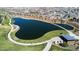 Breathtaking aerial view of a community lake, surrounded by walking paths and lush green spaces at 9230 E Scott Ave, Mesa, AZ 85212