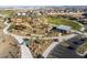 Aerial view of community park featuring walking paths, playgrounds, green spaces and views of the neighborhood at 9230 E Scott Ave, Mesa, AZ 85212