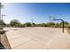 Well-maintained outdoor basketball court with multiple hoops, perfect for recreational activities and sports enthusiasts at 9230 E Scott Ave, Mesa, AZ 85212