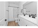 Modern bathroom featuring a double sink vanity, sleek fixtures, and a shower-tub combination at 9230 E Scott Ave, Mesa, AZ 85212