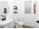 Contemporary half bathroom with pedestal sink, sleek faucet, and decorative shelves at 9230 E Scott Ave, Mesa, AZ 85212