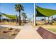 Scenic community park featuring a playground and expansive green space, offering a serene recreational area at 9230 E Scott Ave, Mesa, AZ 85212