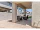 An inviting covered patio with comfortable seating, perfect for enjoying outdoor living and entertaining guests at 9230 E Scott Ave, Mesa, AZ 85212