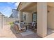 A welcoming covered patio with stylish furniture, providing a relaxing space for outdoor gatherings and leisure at 9230 E Scott Ave, Mesa, AZ 85212