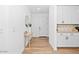 Inviting entryway with stylish console table, mirror, and elegant cabinetry at 9230 E Scott Ave, Mesa, AZ 85212