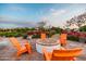 Inviting outdoor fire pit area with comfortable seating, ideal for cozy evenings and social gatherings at 9230 E Scott Ave, Mesa, AZ 85212