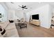 Bright living room showcasing a sectional sofa, modern décor, and ample natural light at 9230 E Scott Ave, Mesa, AZ 85212