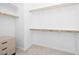 Walk-in closet provides ample storage with built-in shelving and drawers for organization at 9230 E Scott Ave, Mesa, AZ 85212