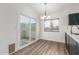 Bright dining area with access to outdoor patio, complemented by modern flooring and fixtures at 1047 W Laguna Dr, Tempe, AZ 85282