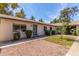 Charming single story home featuring a well-manicured front lawn and desert landscaping at 1047 W Laguna Dr, Tempe, AZ 85282