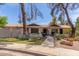 Charming townhome featuring lovely landscaping and a welcoming walkway to the front entrance at 1047 W Laguna Dr, Tempe, AZ 85282