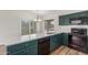 Modern kitchen featuring quartz countertops, stainless appliances, and laminate floors at 1047 W Laguna Dr, Tempe, AZ 85282
