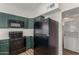 Updated kitchen with modern appliances and adjoining laundry closet at 1047 W Laguna Dr, Tempe, AZ 85282