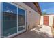 View of the home's private patio with large sliding glass doors at 1047 W Laguna Dr, Tempe, AZ 85282