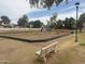 Community playground with swing set, slide, and seesaw for residents at 1047 W Laguna Dr, Tempe, AZ 85282