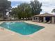 Community pool with lounge chairs and covered picnic area at 1047 W Laguna Dr, Tempe, AZ 85282