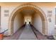 Covered walkway leading to the front door, with decorative stone and well-maintained landscaping at 1047 W Laguna Dr, Tempe, AZ 85282