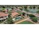Wonderful aerial view of home featuring a backyard oasis with a private pool, lush landscaping, and lake access at 11101 W Wilshire Dr, Avondale, AZ 85392
