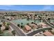 Expansive aerial view of a home with lush landscaping and a scenic view of the lake at 11101 W Wilshire Dr, Avondale, AZ 85392