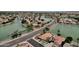 Beautiful aerial view of lakeside homes with lush landscaping and scenic water views in a desirable community at 11101 W Wilshire Dr, Avondale, AZ 85392