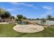 Backyard features a pool, hot tub, patio, and lake views; a perfect blend of luxury and nature at 11101 W Wilshire Dr, Avondale, AZ 85392