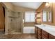 Well lit bathroom featuring a tiled shower, vanity and bathtub at 11101 W Wilshire Dr, Avondale, AZ 85392