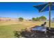 Dog park with green space and shaded seating, ideal for pet owners at 11101 W Wilshire Dr, Avondale, AZ 85392
