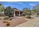 Inviting home exterior featuring desert landscaping, a covered porch, and stone pathway to the front door at 11101 W Wilshire Dr, Avondale, AZ 85392