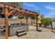 Relaxing outdoor hot tub under a pergola, providing a tranquil experience at 11101 W Wilshire Dr, Avondale, AZ 85392