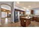 View of kitchen with stainless steel appliances and granite countertop island at 11101 W Wilshire Dr, Avondale, AZ 85392