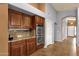 Kitchen with a granite countertop, stainless steel double ovens and hardwood cabinets at 11101 W Wilshire Dr, Avondale, AZ 85392