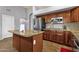 Kitchen with stainless steel refrigerator, granite countertops and tile backsplash at 11101 W Wilshire Dr, Avondale, AZ 85392
