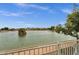 Lake view from the property's fence, offering a serene and calming ambiance at 11101 W Wilshire Dr, Avondale, AZ 85392