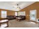 Spacious living room with plush furniture, fan and carpeted flooring at 11101 W Wilshire Dr, Avondale, AZ 85392