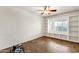 Featuring a window with built-in shelves, this room offers natural light and storage space at 11101 W Wilshire Dr, Avondale, AZ 85392
