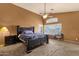 Vaulted main bedroom featuring a ceiling fan and plush carpeted flooring at 11101 W Wilshire Dr, Avondale, AZ 85392