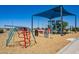 Community playground featuring colorful climbing structures and slides for children at 11101 W Wilshire Dr, Avondale, AZ 85392
