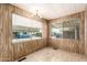 Sunny dining room with tile floors, wood-paneled walls, and plenty of natural light at 11411 N 91St Ave # 28, Peoria, AZ 85345