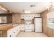Bright kitchen featuring white appliances, light wood countertops, and plenty of cabinet space at 11411 N 91St Ave # 28, Peoria, AZ 85345