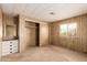 Main bedroom with a large window, dresser, and closet offers ample space and natural light at 11411 N 91St Ave # 28, Peoria, AZ 85345