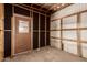 Interior view of an unfinished storage area with wooden framing at 11411 N 91St Ave # 28, Peoria, AZ 85345