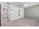 This bedroom features neutral colored walls and carpet, and a ceiling fan at 12719 W Ashwood Dr, Sun City West, AZ 85375