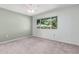 Comfortable bedroom with carpet, ceiling fan, and window offering natural light and a pleasant view at 12719 W Ashwood Dr, Sun City West, AZ 85375