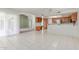 Bright kitchen featuring updated cabinets, stainless steel appliances, breakfast bar, tile floors, and an adjacent breakfast nook at 12719 W Ashwood Dr, Sun City West, AZ 85375
