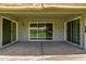 Covered patio with concrete flooring and sliding glass doors at 12719 W Ashwood Dr, Sun City West, AZ 85375