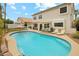 Large backyard showcasing in-ground pool, ample seating and lounge chairs, and drought-tolerant landscaping at 1285 E Horseshoe Ave, Gilbert, AZ 85296