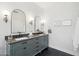 Bathroom with dual sinks, modern fixtures, and arched mirrors offering a sleek and stylish design at 1285 E Horseshoe Ave, Gilbert, AZ 85296