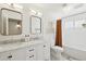 Bright bathroom featuring double sinks, updated vanity, neutral walls and updated flooring at 1285 E Horseshoe Ave, Gilbert, AZ 85296