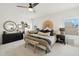 Relaxing bedroom featuring neutral tones, stylish decor, and a large window for natural light at 1285 E Horseshoe Ave, Gilbert, AZ 85296